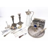 A small collection of silver plate, including a pair of Sheffield plated candlestick, a claret jug