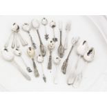 A small group of spoons and forks, including a set of three filigree examples, a silver spoon and