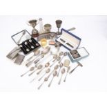 A collection of silver and other items, including a silver goblet, cigarette case, a cased set of