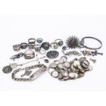 A collection of silver jewels, including an a George V silver heart shaped box locket, a Charles