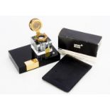 A modern Montblanc inkwell, together with a Montblanc black leather notepad holder and a bottle of