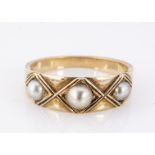 A yellow gold and half pearl ring, the three half cut pearls in lozenge settings, with tapered