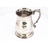 A George III silver tankard by JW, 12.5cm high, 12.55 ozt, some dents, with engraved initials,