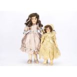 Two German bisque headed dolls, an Armand Marseille 390 child doll with blue sleeping eyes, brown