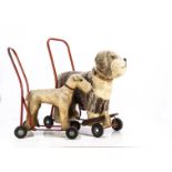 Two post-war Lines dogs on wheels, with metal steel tubular frames --22 ½in. (57cm.) long (worn