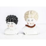 Two Pet Name china shoulder heads, a blonde Esther with coral necklace --7in. (18cm.) high (firing