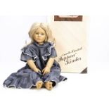 An Annette Himstedt Malin artist doll, vinyl girl doll with hair wig, in original box with