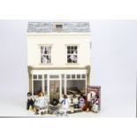 A Sid Cooke wooden dolls' house shop 1988, front opening with lift off roof --24 ¼in. (62cm.)