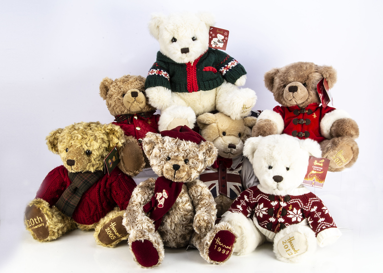 Six Harrods Annual Christmas teddy bears, including a John Henry Dickin Bear in original box for