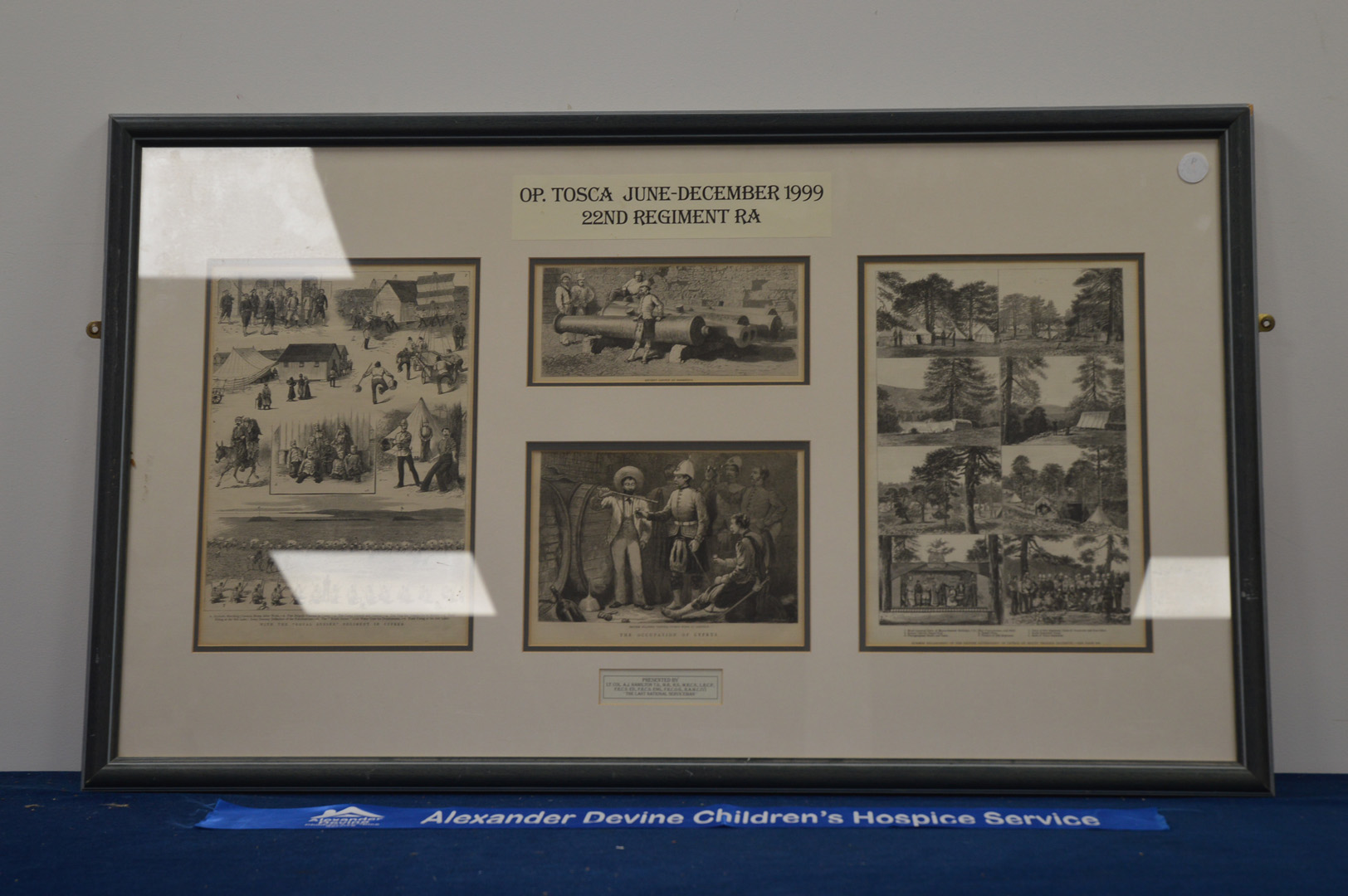 A framed and mounted set of military etchings, given to Lt. Col. A. J. Hamilton 1999, 60cm x 101cm