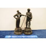 A pair of Victorian spelter figurines, male and female farm workers with tools in hand on