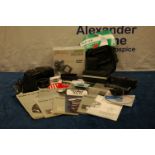 A collection of camera accessories, including manuals IMPORTANT! REGARDING CONDITION REPORTS: Please