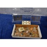 A collection of British and World loose coins, including three plastic cased sets, Irish pennies,