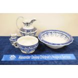 An early 20th Century Staffordshire pottery toilet set, comprising wash bowl, jug, potty and vase,