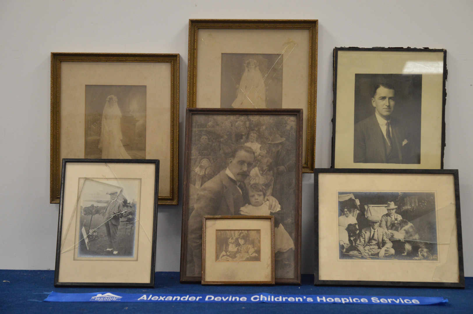 A collection of framed family photographs, in varying conditions, the largest 38cm x 25cm (7)