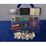 A collection of British and Commonwealth commemmorative cased and loose crowns and other coins