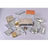 An assortment of cigarette cases and other related items, including a few silver examples, various