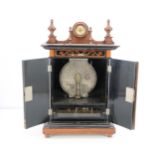 A 9-inch Britannia upright disc musical box, with crossbanded walnut doors with Britannia and