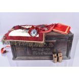 A ROAB Swan Lodge 1931 Regalia carved storage box, together with a sash, an apron and cuffs, plus