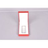 A Must de Cartier brushed chrome pocket lighter, with tri-metal design the to top of the lid, serial