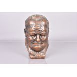 A bronzed painted ceramic bust of Sir Winston Churchill, dated 1940, with maker's name J Col*****,