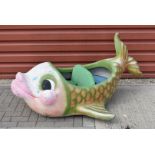 A 1970s Fairground fibreglass double seated fish from a child's ride,, probably from a Merry Go