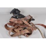A large collection of Post War leather belts and accessories, to include holsters, ammunition