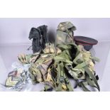 An assortment of various items, to include a combat vest, jungle boots, water bottle and carrier,