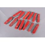 A group of 13 Swiss Army Knives, various maker's including Officer Suisse, Victorinox and many