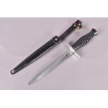 A French Paratrooper's Combat Knife, by Inox, circa 1950s, 19cm long double edged blade, complete