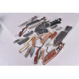 An extensive assortment of knives, to include, penknives, hunting knives, pocket knives and more,