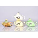 Four early 20th Century pottery Churchill Tank teapots, possibly Sadler, in four different colour