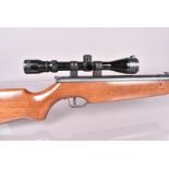 A Cometa 300 .177 air rifle, with break barrel action, tunnel foresight, and Simmons scope sold as