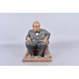 Tom Clark, a 1991 resin figure of a seated Winston Churchill, holding the script of his first speech