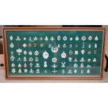 A well presented British Cap badge display, comprising of badges of various ages, including Stay