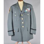 A US Army uniform, comprising of Jacket (size 43XL) with large medal board to chest, OD Jungle patch
