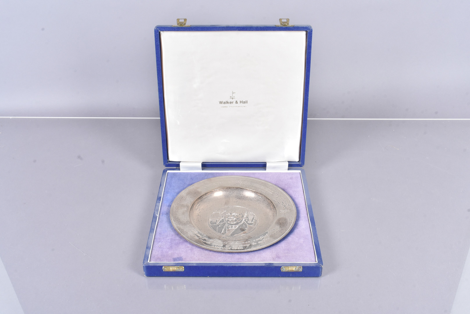 Silver Centenary Presentation dish by Walker & Hall, dated Sheffield 1973/74, the dish with a relief