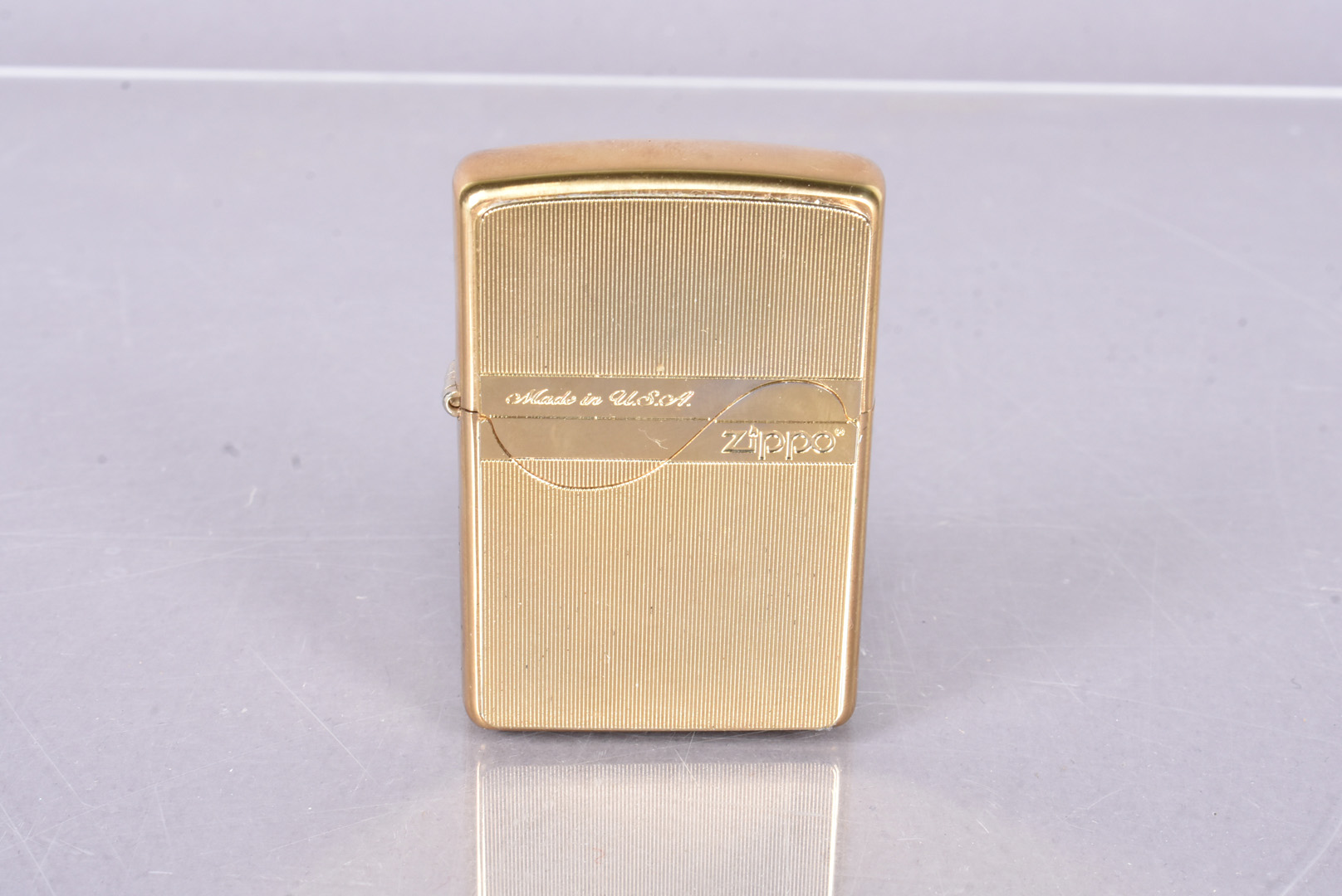 A 2020 engine worked brass 'Made in USA' Zippo lighter, for the Japanese market