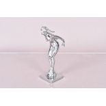 A chromed car mascot by NLC Co, modelled as a nude female, with NLC Co stamped to the side, on base,