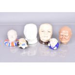 Two Michael Sutty porcelain heads of Sir Winston Churchill, together with two Churchill Face Pots by