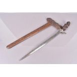 A 19th Century Executioner's Kris, with 43cm long steel blade, with gilt metal and paste set collar,