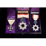 Three WWII Japanese Orders and Medals, comprising The Order of the Rising Sun Third Class, Order