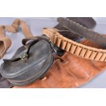 Two vintage gun slips, one in light brown leather, the other dark brown, together with a