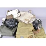 A WWII gas mask carrier, the carrier dated 1942m together with a WWII canvas bag/basin, plus a