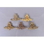 Royal Artillery (RA), five badges, comprising an 02/53 example, a WWI brass example, a 53/56, a