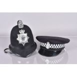 A Northumbria Police helmet, with comb top, together with a Lancashire Constabulary peak cap (2)