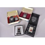 Two cased 60th Anniversary Zippo lighters, with cases, together with a 75th Anniversary example,