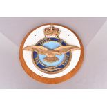A large wooden Royal Air Force wall plaque, hand painted, with the Queen's Crown to the top, 39cm