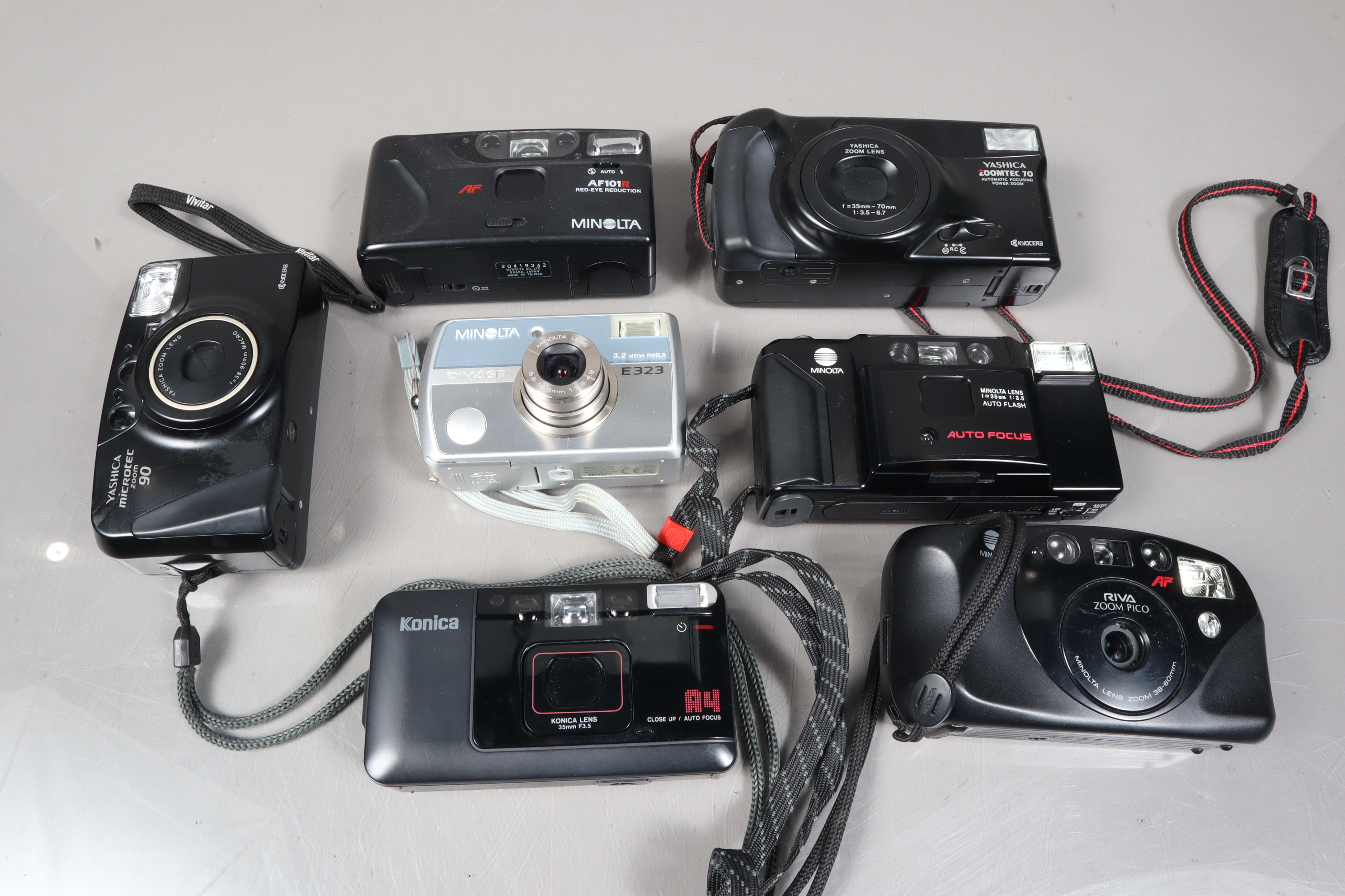 A Small Tray of Minolta and Other Compact Cameras, comprising a Minolta AF-E, an AF101R, a Riva Zoom