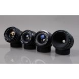 Four Minolta Lenses, a Minolta MD Macro 50mm F/3.5 lens, a MC W Rokkor SI 28mm f/2/.5 lens, a MD W